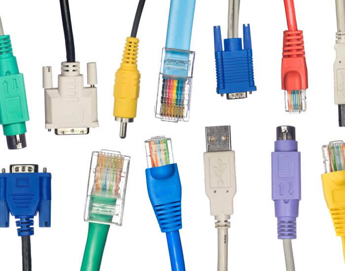 An assortment of computer cables in a variety of colors.