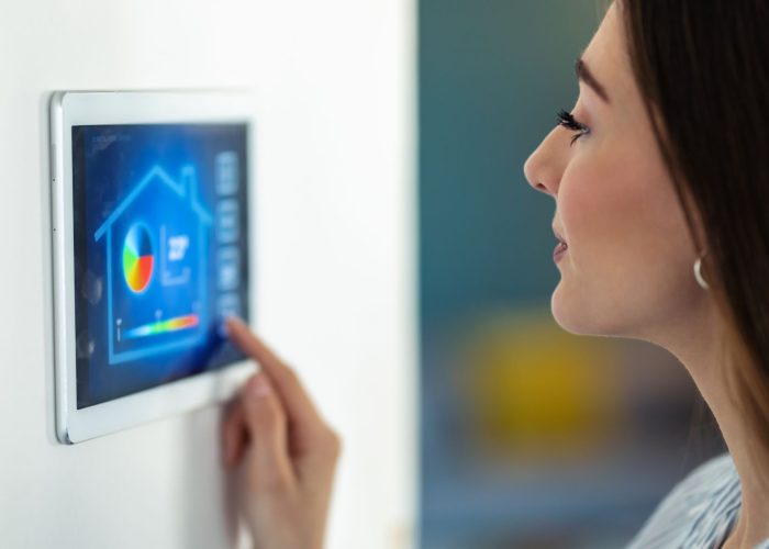pretty-young-woman-using-the-home-automation-syste-2021-08-28-20-06-53-utc (1)